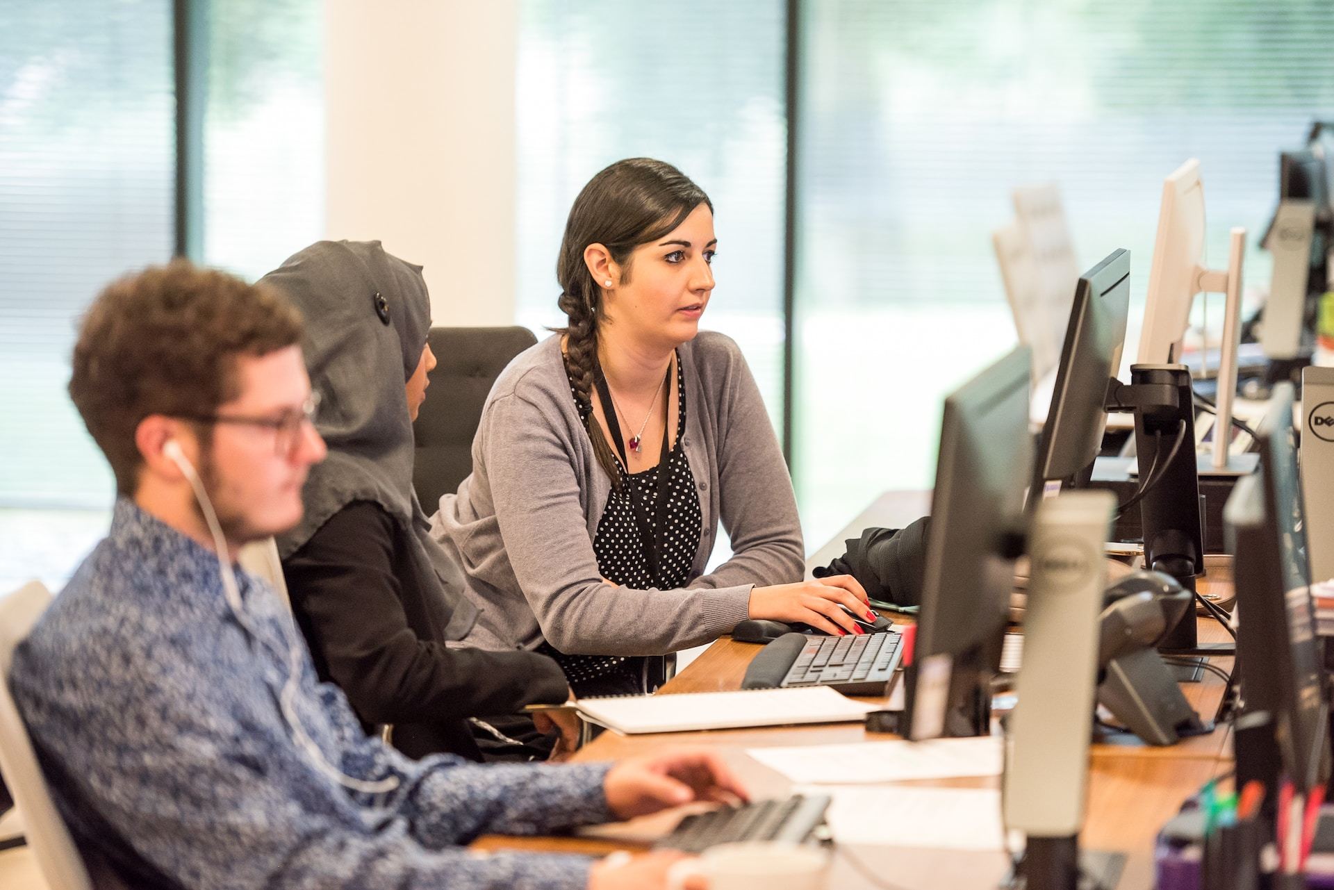 People at work (Photo by Arlington Research on Unsplash)